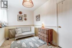 Wood-finish flooring, two-tone painted walls, and a built-in window ledge - 