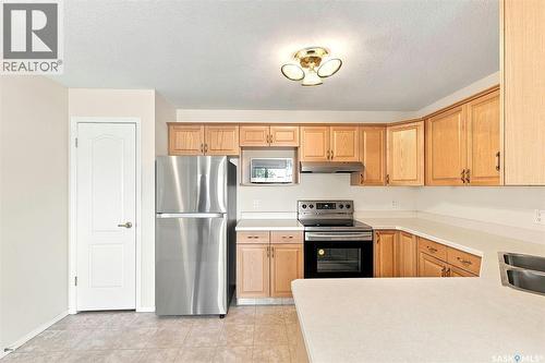 304 6 Lorne Place, Regina, SK - Indoor Photo Showing Kitchen With Stainless Steel Kitchen With Double Sink