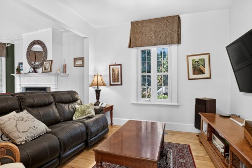 Salon - 14 Rue Morris, Sainte-Thérèse, QC - Indoor Photo Showing Living Room With Fireplace