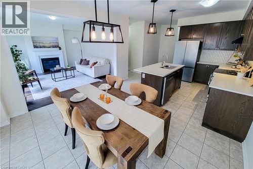 Open-concept kitchen and dining area with tile flooring - 11 Esther Crescent, Thorold, ON - Indoor With Fireplace