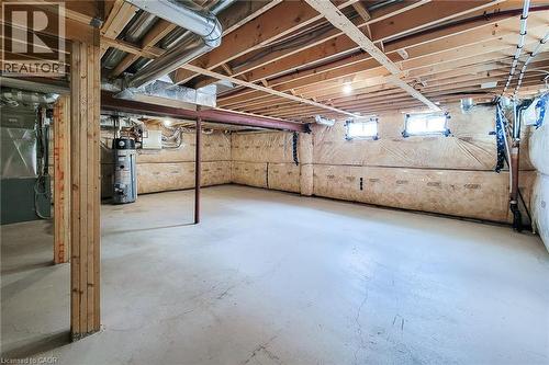 Unfinished basement with concrete flooring and exposed ceiling joists - 11 Esther Crescent, Thorold, ON - Indoor Photo Showing Basement