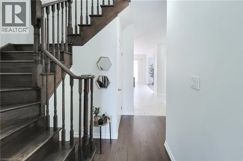 Hardwood staircase with turned balusters and dark wood-finish treads - 11 Esther Crescent, Thorold, ON - Indoor Photo Showing Other Room