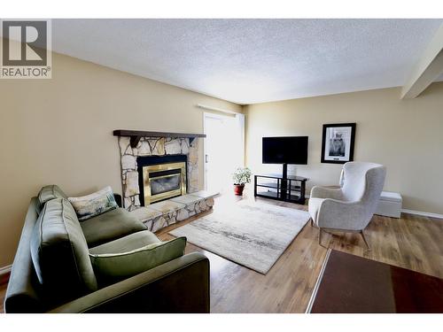 111 Tabor Boulevard, Prince George, BC - Indoor Photo Showing Living Room With Fireplace