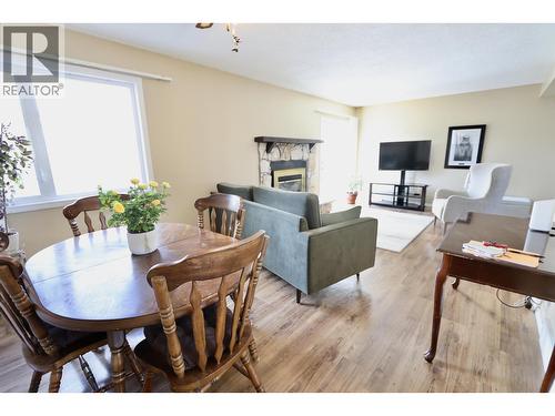 111 Tabor Boulevard, Prince George, BC - Indoor Photo Showing Dining Room With Fireplace