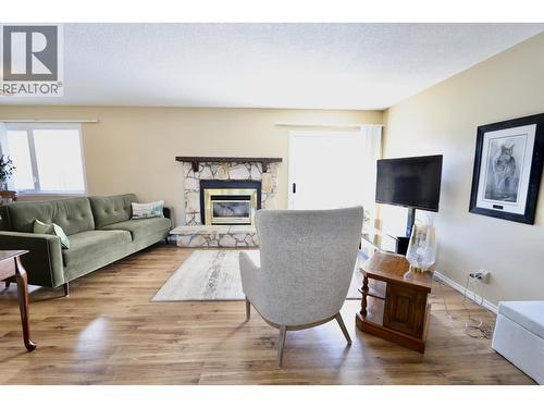 111 Tabor Boulevard, Prince George, BC - Indoor Photo Showing Living Room With Fireplace
