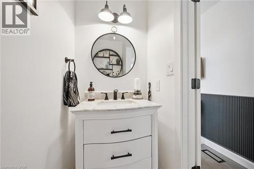 White vanity with a light-toned countertop, under-mount sink, and matte black faucet - 439 Beaver Creek Road, Waterloo, ON - Indoor Photo Showing Bathroom