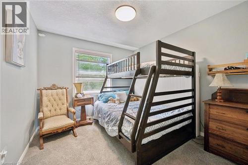Neutral-toned wall paint and carpeting throughout - 439 Beaver Creek Road, Waterloo, ON - Indoor Photo Showing Bedroom