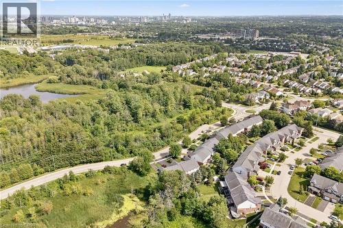Aerial perspective showcasing a residential community and natural areas - 439 Beaver Creek Road, Waterloo, ON - Outdoor With View