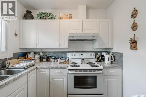 127 107Th Street W, Saskatoon, SK - Indoor Photo Showing Kitchen With Double Sink