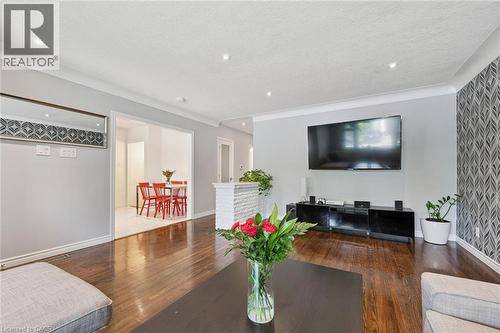 Hardwood-finish flooring, recessed lighting, and crown molding - 49 East Street, Cambridge, ON - Indoor Photo Showing Living Room