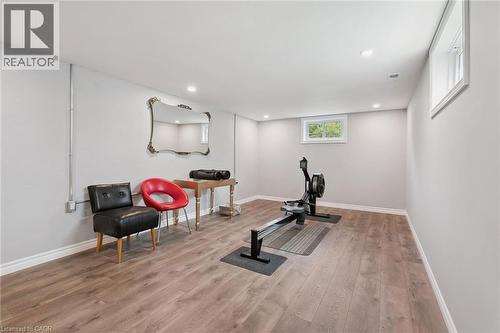 Recessed lighting, wood-finish flooring, white trim, and two windows - 49 East Street, Cambridge, ON - Indoor Photo Showing Gym Room