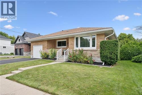 Brick exterior with stone accents and a sloped roof - 49 East Street, Cambridge, ON - Outdoor