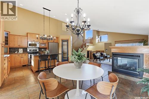 703 Beechmont Lane, Saskatoon, SK - Indoor Photo Showing Dining Room With Fireplace