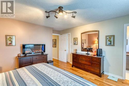 View to Walk-In Closet + Ensuite to Right ... - 58 Decaria Boulevard, Perth, ON - Indoor Photo Showing Bedroom