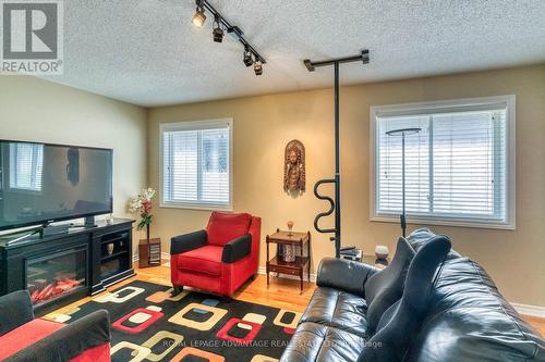 2nd Bedroom, Currently Used as TV Room ... - 58 Decaria Boulevard, Perth, ON - Indoor Photo Showing Living Room With Fireplace