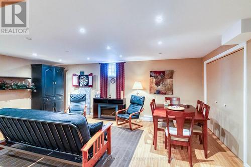 Comforting L/L Family Room ... - 58 Decaria Boulevard, Perth, ON - Indoor With Fireplace