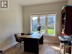 Hardwood-style flooring, large window with backyard visibility, - 