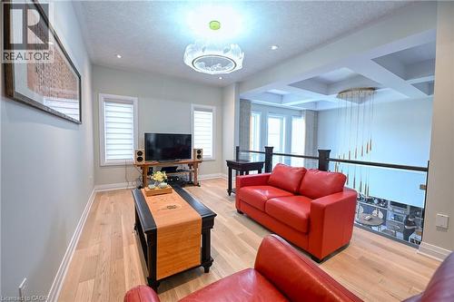 Hardwood flooring, recessed lighting, and a coffered ceiling - 923 Eaglecrest Court, Kitchener, ON - Indoor Photo Showing Living Room