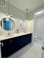 Dual vanity with a white countertop and undermount sinks - 