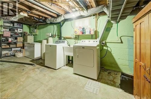 Utility area with concrete flooring and exposed ceiling joists - 34 St Clair Avenue, Kitchener, ON - Indoor Photo Showing Laundry Room