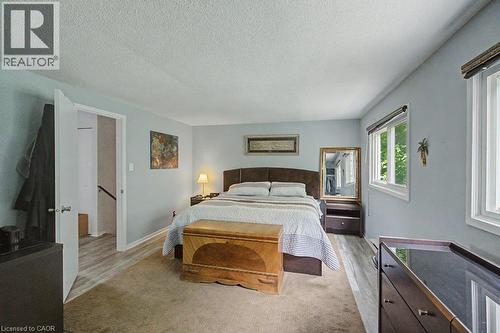 Expansive room featuring two windows, light blue walls, and a recessed doorway - 2050 Upper Middle Road Unit# 164, Burlington, ON - Indoor Photo Showing Bedroom