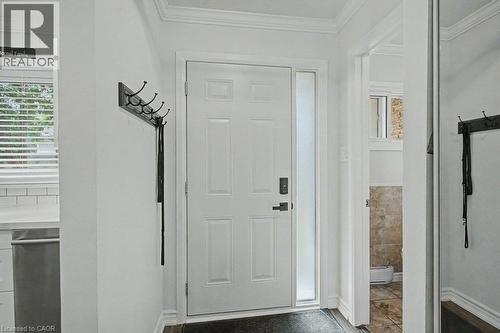 White paneled entry door with frosted sidelight - 2050 Upper Middle Road Unit# 164, Burlington, ON - Indoor Photo Showing Other Room