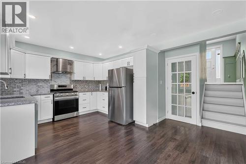 Kitchen featuring white cabinetry, stainless steel appliances, dark wood-finish flooring, and recessed lighting - 66 Summercrest Drive Unit# 3, Hamilton, ON - Indoor Photo Showing Kitchen With Upgraded Kitchen