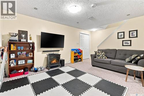1030 Orchid Way N, Regina, SK - Indoor Photo Showing Living Room With Fireplace