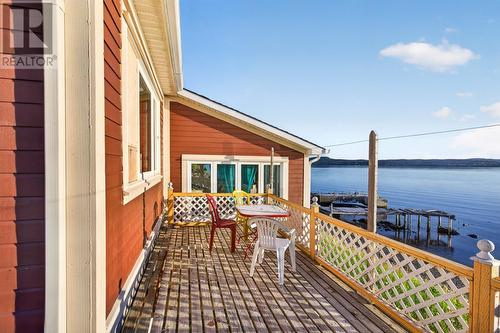Deck overlooks the water - 15 Main Road, Dildo, NL - Outdoor With Body Of Water With Exterior