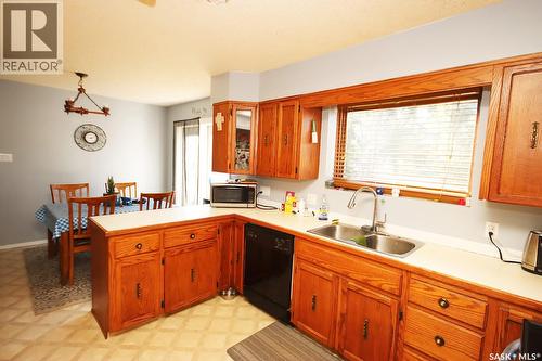506 Garrish Place, Estevan, SK - Indoor Photo Showing Kitchen With Double Sink