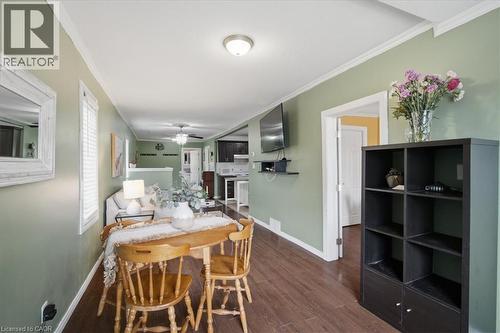 Wood-finish flooring throughout the space - 22 Delena Avenue N, Hamilton, ON - Indoor Photo Showing Kitchen With Double Sink