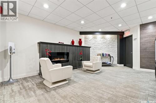 506 611 University Drive, Saskatoon, SK - Indoor Photo Showing Other Room With Fireplace