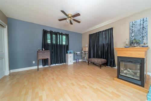 39003 Uppingham Road, Anola, MB - Indoor Photo Showing Living Room With Fireplace