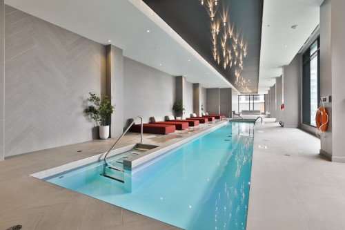 Piscine - 205-700 Rue Des Éclaircies, Brossard, QC - Indoor Photo Showing Other Room With In Ground Pool