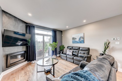 Living Room - 650 Rue Du Damier-Argenté, La Prairie, QC - Indoor Photo Showing Living Room With Fireplace