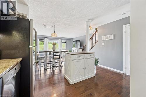 Wood-finish flooring throughout the main level - 308 Parkvale Drive, Kitchener, ON - Indoor Photo Showing Kitchen