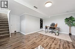 Wood-finish flooring, recessed shelving, and a flush-mount ceiling light - 