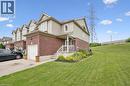 Brick and siding exterior with a single-car garage and a paved driveway - 308 Parkvale Drive, Kitchener, ON  - Outdoor 