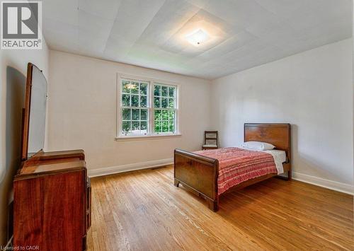 Hardwood flooring, white painted walls, multi-pane window, and flush mount ceiling light - 321 Highland Park, Cambridge, ON 