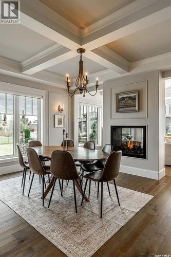 107 Mahabir Crescent, Saskatoon, SK - Indoor Photo Showing Dining Room With Fireplace