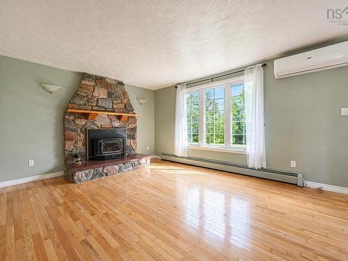 365 Johnson Rd, Georges River, NS - Indoor Photo Showing Living Room With Fireplace