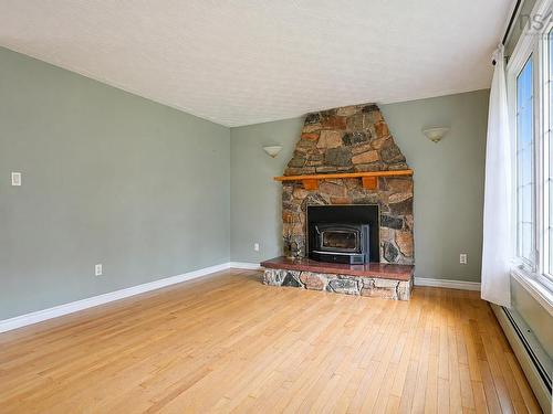 365 Johnson Rd, Georges River, NS - Indoor Photo Showing Living Room With Fireplace