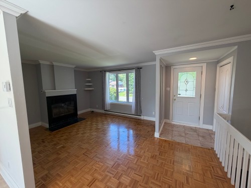 Salon - 2703 Av. Bériot, Boisbriand, QC - Indoor With Fireplace