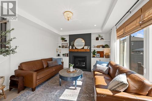 720 Coast Circle, Ottawa, ON - Indoor Photo Showing Living Room With Fireplace