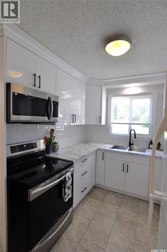407 Wathaman Crescent, Saskatoon, SK - Indoor Photo Showing Kitchen With Double Sink
