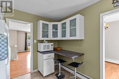 Kitchen with convenient breakfast bar - 22 Holbrook Avenue, St. John'S, NL - Indoor Photo Showing Kitchen