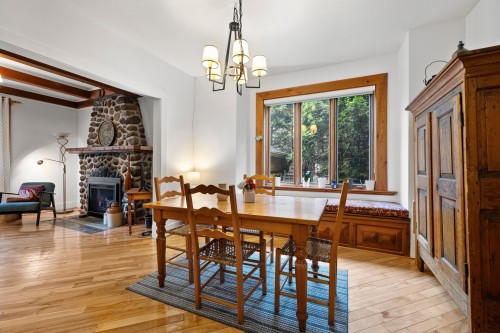 Salle à manger - 26 Av. Cedar, Pointe-Claire, QC - Indoor Photo Showing Dining Room With Fireplace