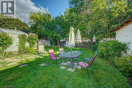 Expansive lawn area with mature trees and a stone pathway - 97 Francis Street, Cambridge, ON - Outdoor
