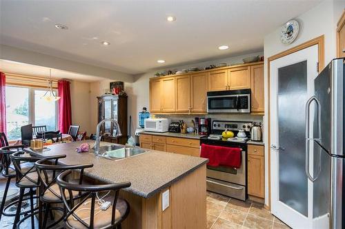 11 Brunet Prom, Winnipeg, MB - Indoor Photo Showing Kitchen With Double Sink