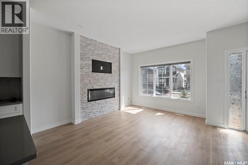 5116 E Simard Avenue, Regina, SK - Indoor Photo Showing Living Room With Fireplace